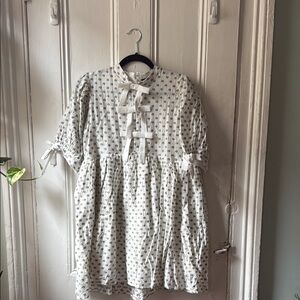 Charming White Dress with Bow Accents Sister Jane